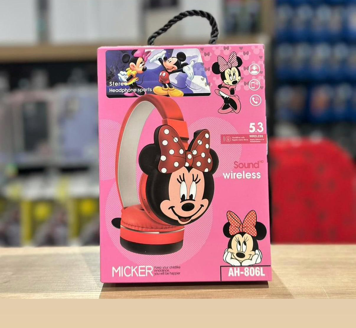 Mickey Kids Headset packaging with Minnie Mouse design on a shelf.