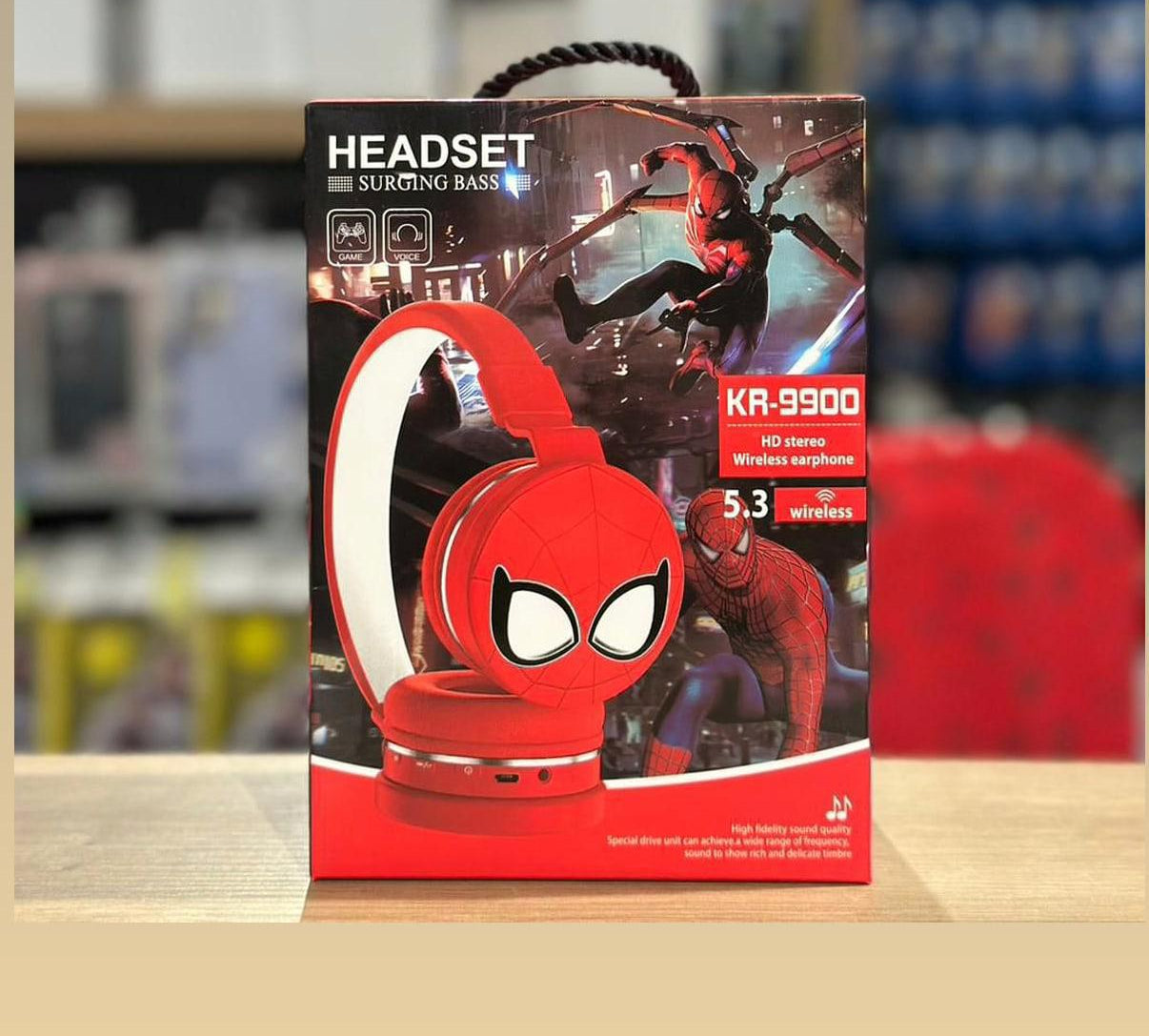 Box of Spider-Man themed headphones on a blurred background